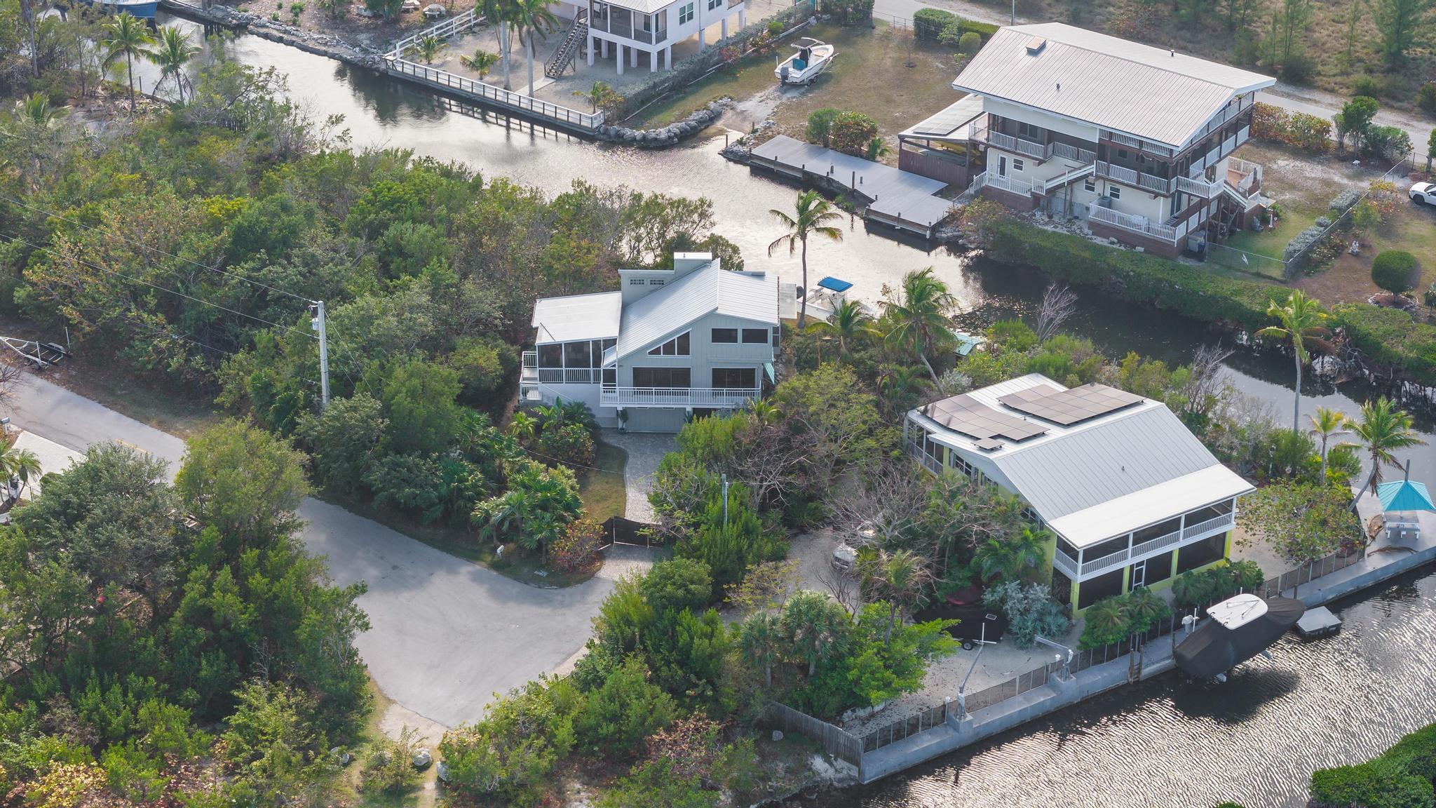 2148 Bahia Shores Road Big Pine Key, FL 33043 - Photo 31 of 35 an aerial view of a house with a yard and lake view