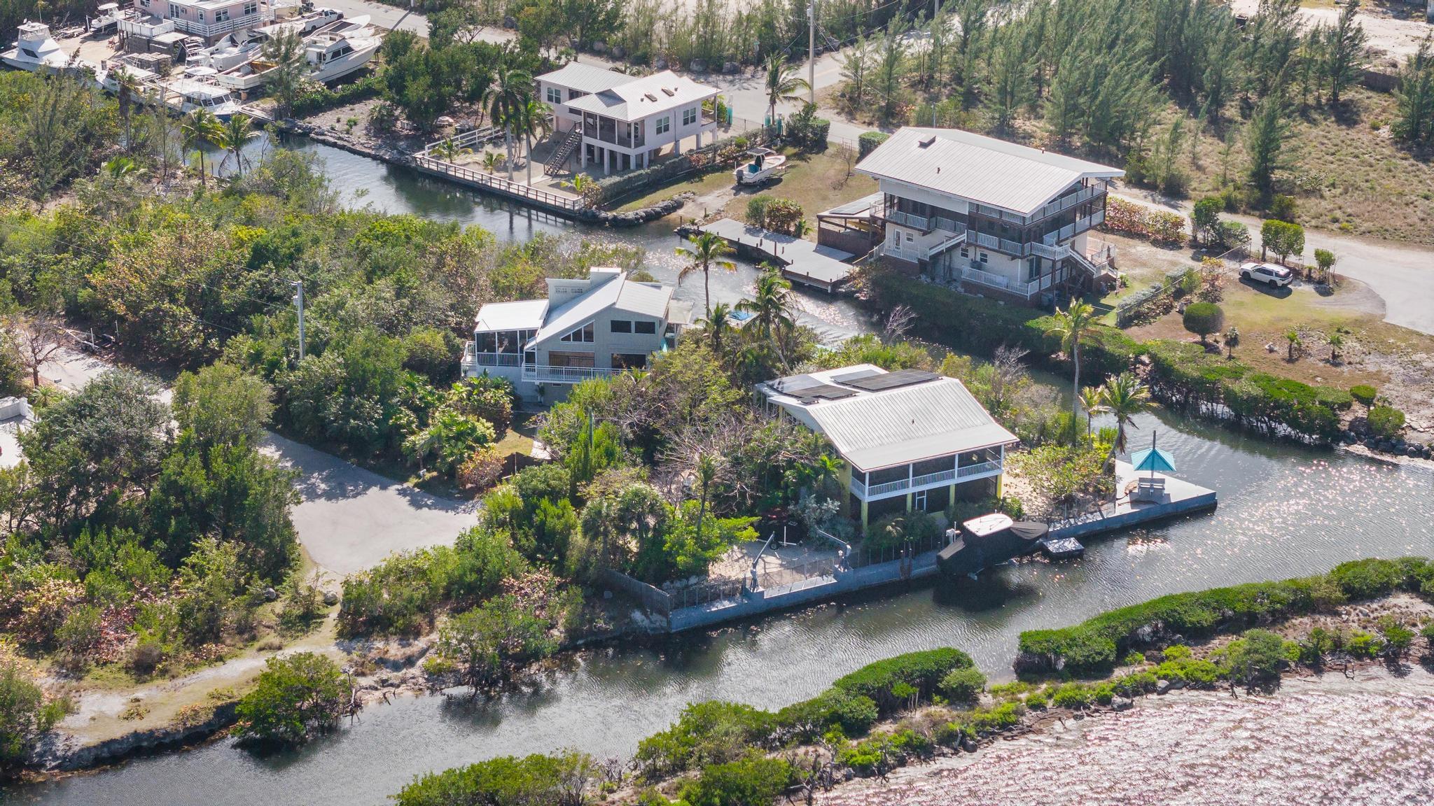 2148 Bahia Shores Road Big Pine Key, FL 33043 - Photo 33 of 35 an aerial view of a house with a yard and lake view