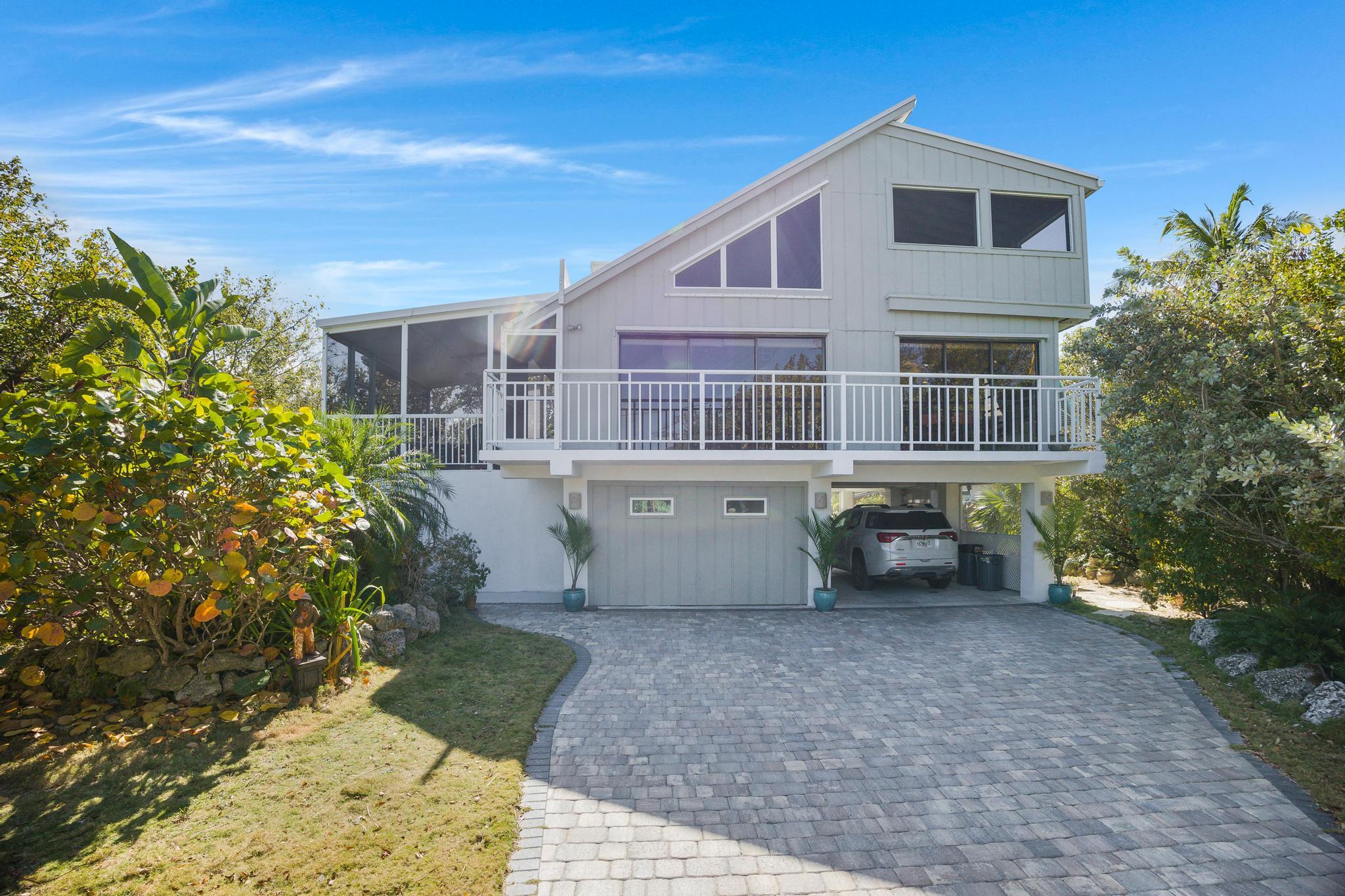 2148 Bahia Shores Road Big Pine Key, FL 33043 - Photo 4 of 35 a view of a house with backyard and garden