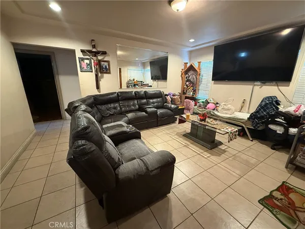 a bedroom with a bed closet and a mirror