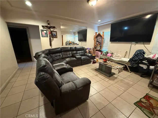 a bedroom with a bed closet and a mirror
