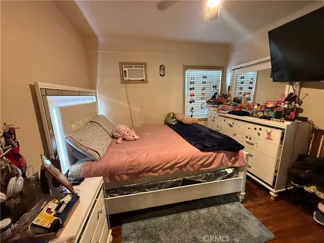 a bed room with furniture and a window