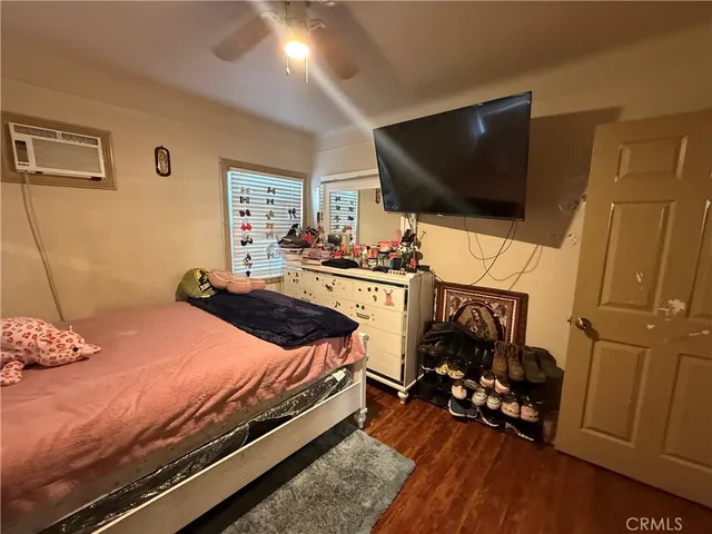 a bed sitting in a bedroom next to a window