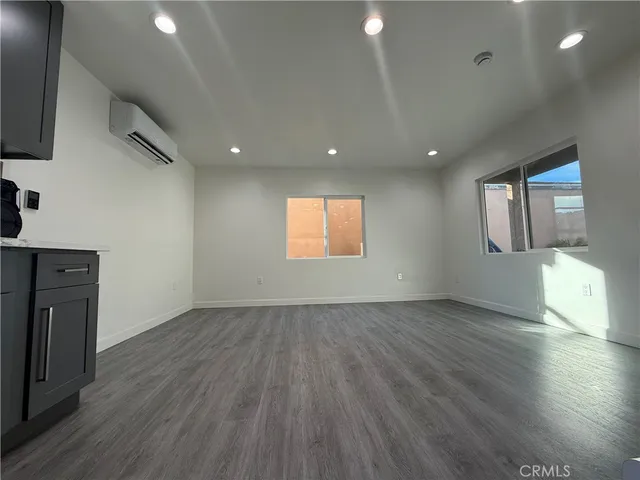 a bathroom with a granite countertop toilet sink and shower