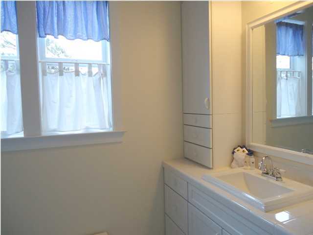 95 Don Bishop Road Santa Rosa Beach, FL 32459 - Photo 14 of 32 a bathroom with a sink and a mirror