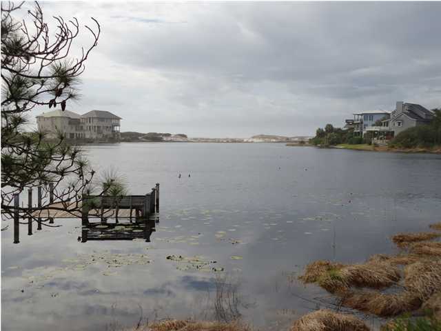 95 Don Bishop Road Santa Rosa Beach, FL 32459 - Photo 32 of 32 a terrace with a bench and lake view
