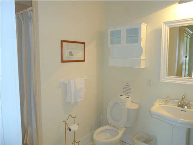 95 Don Bishop Road Santa Rosa Beach, FL 32459 - Photo 4 of 32 a bathroom with a toilet sink vanity granite and mirror