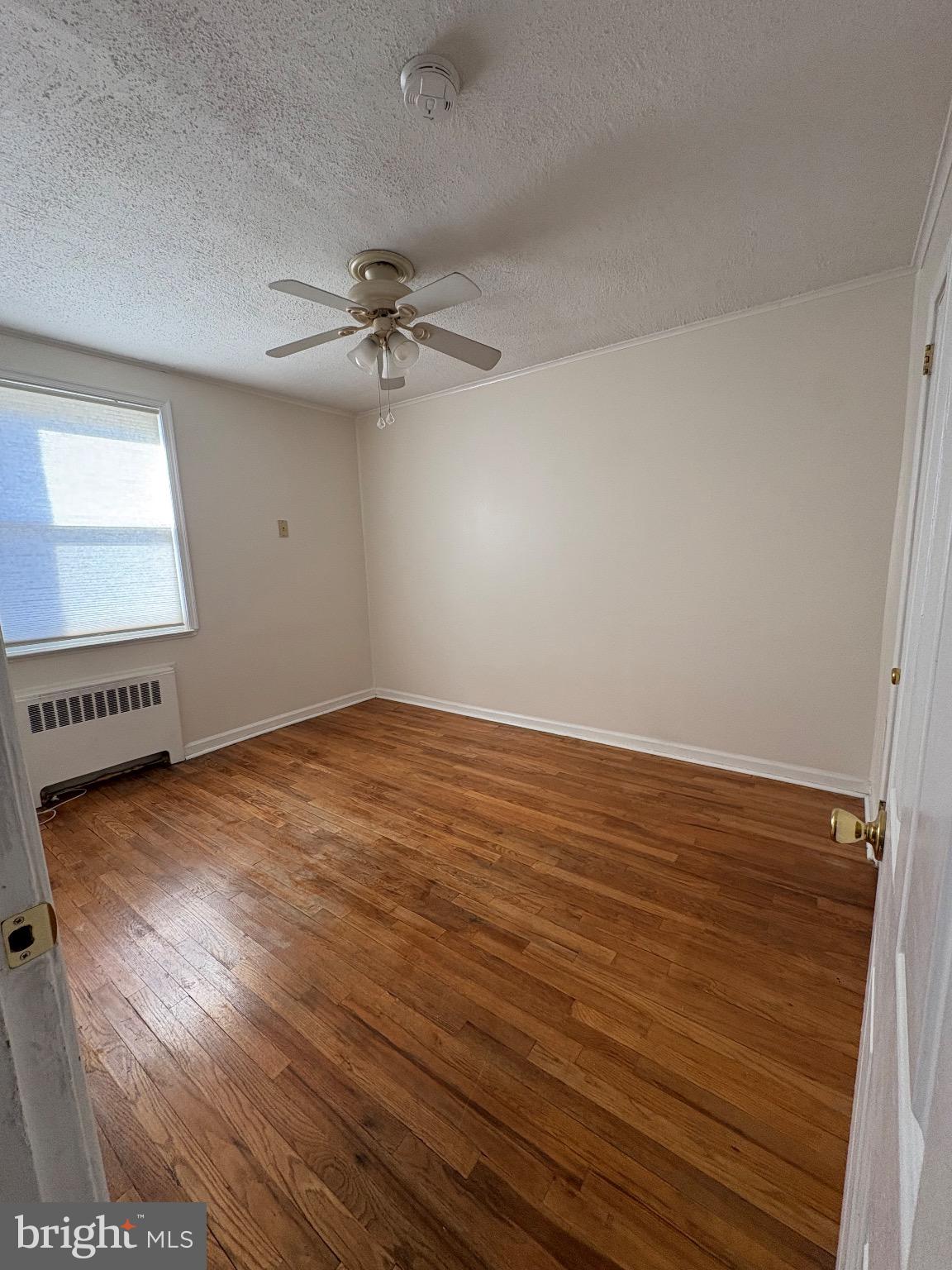 830 Emerson Street, Unit 2 Philadelphia, PA 19111 - Photo 5 of 10 Bright and airy bedroom with hardwood floors.