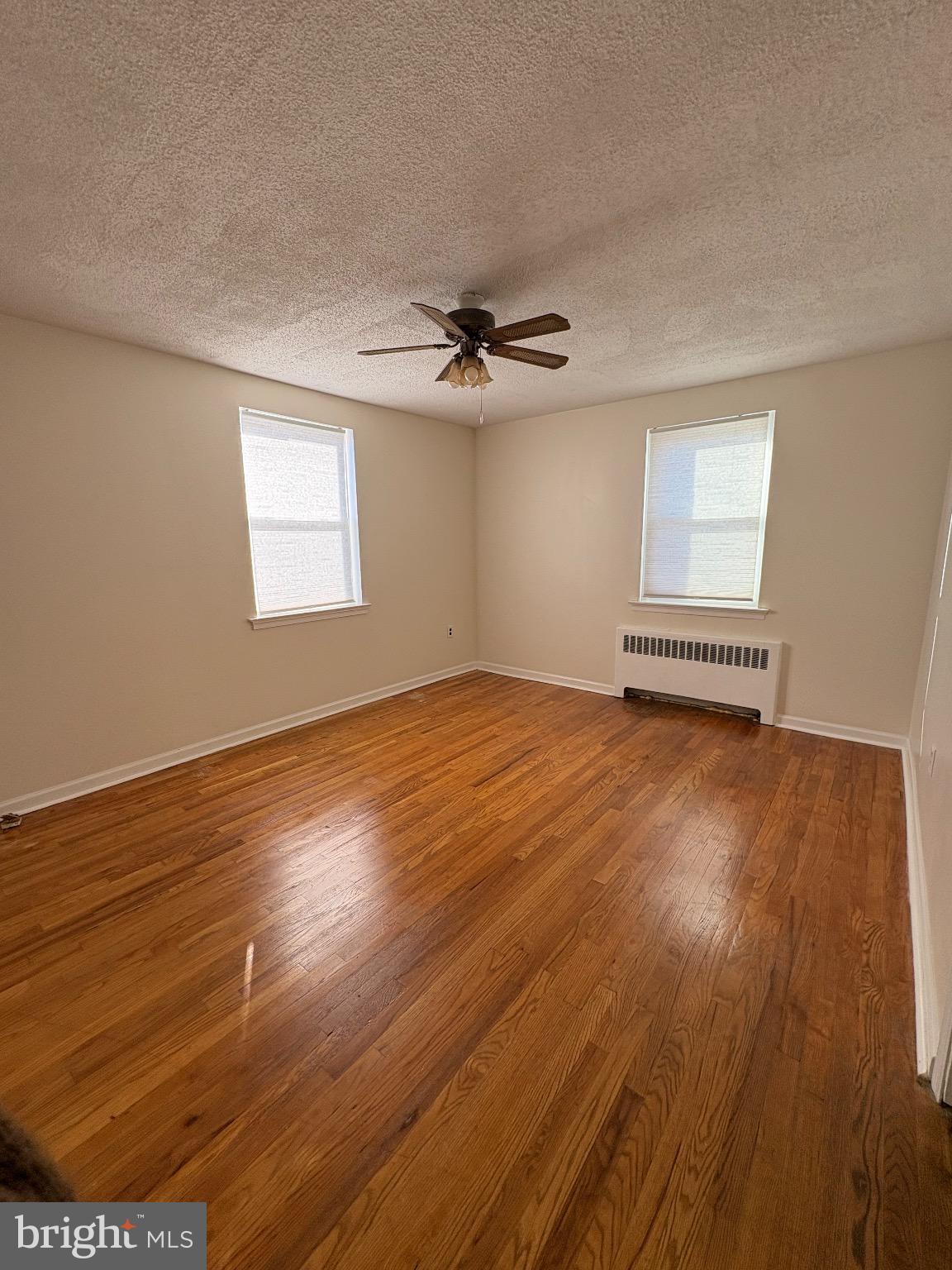 830 Emerson Street, Unit 2 Philadelphia, PA 19111 - Photo 7 of 10 Bright & airy Primary bedroom w/ hardwood floors.