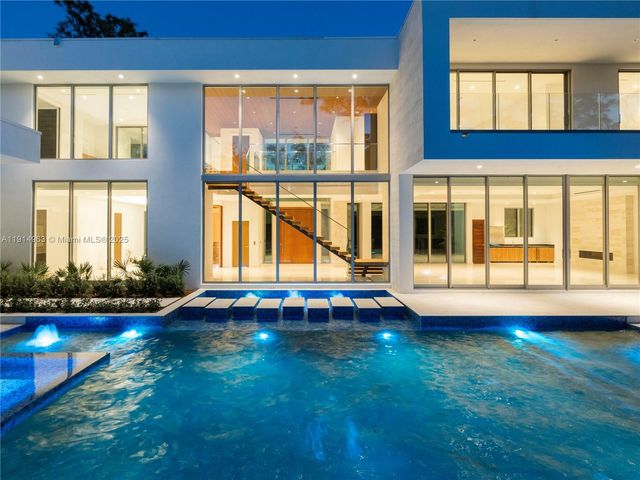 a view of swimming pool with an outdoor space and seating area