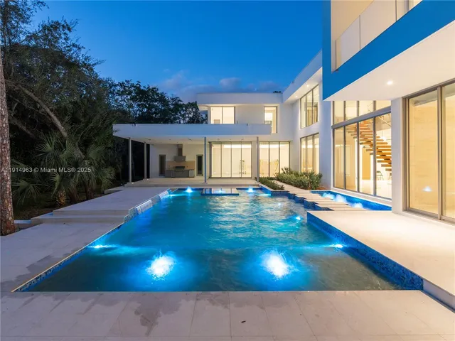 a view of an swimming pool with a yard