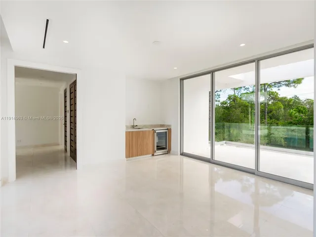 a view of a house with backyard porch and sitting area