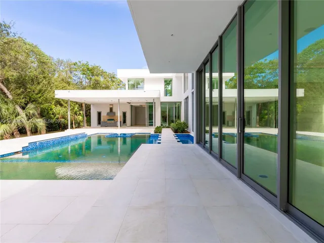 an aerial view of house with a yard