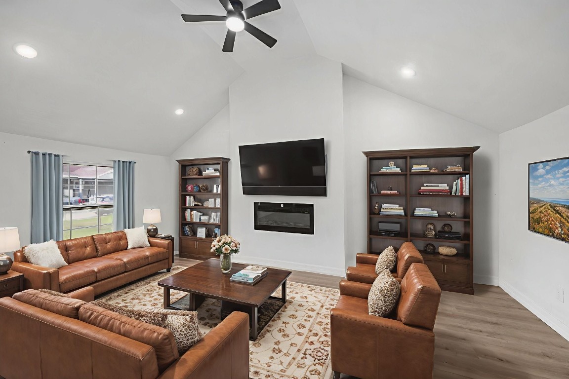 905 Elm Avenue Pasadena, TX 77506 - Photo 11 of 21 a living room with furniture a ceiling fan and a flat screen tv