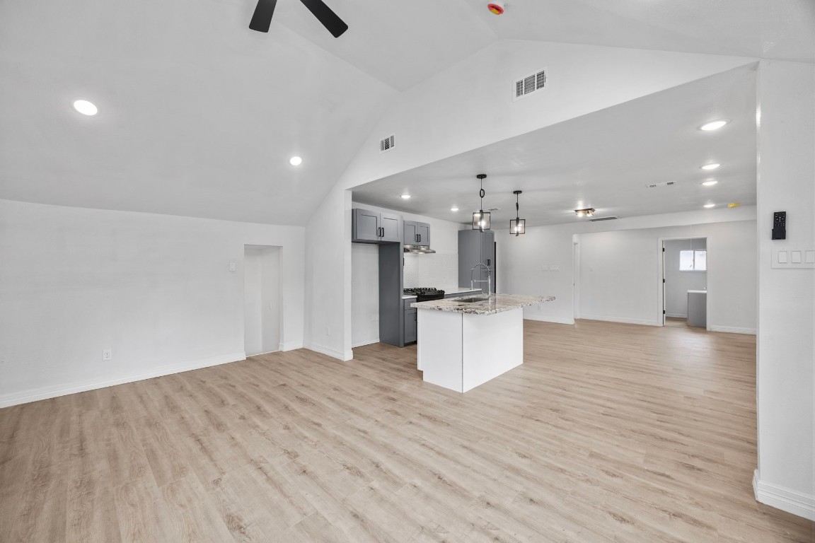 905 Elm Avenue Pasadena, TX 77506 - Photo 12 of 21 a view of kitchen and hall with wooden floor