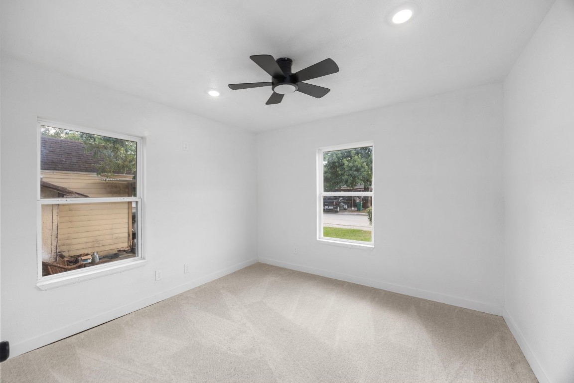 905 Elm Avenue Pasadena, TX 77506 - Photo 14 of 21 an empty room with a window and a ceiling fan