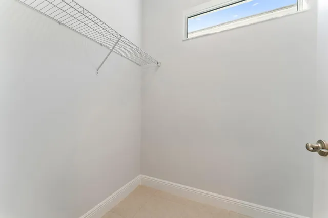 a spacious bathroom with a granite countertop sink a mirror a shower and a bathtub
