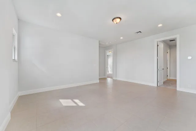 a bathroom with a granite countertop sink a toilet and bathtub