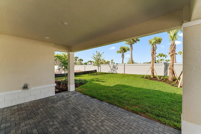 a view of a garden with a building in the background