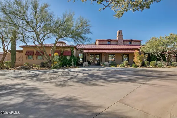 a view of a street with a small yard
