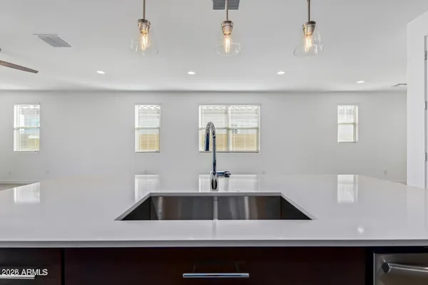 a kitchen with a sink and a refrigerator