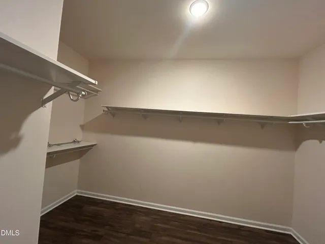 a view of an empty walk in closet