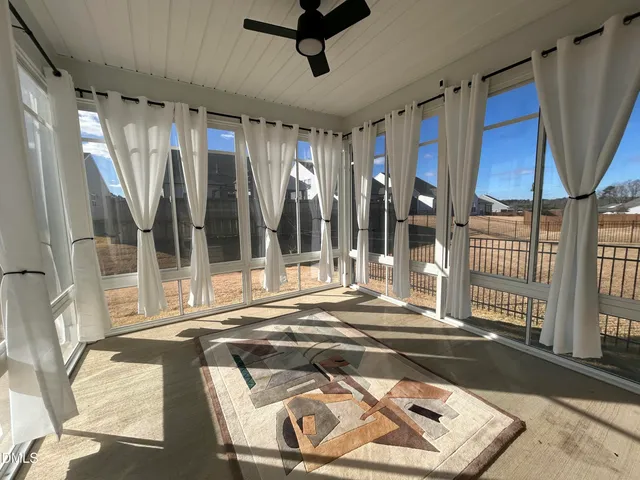 a view of an entryway with a floor to ceiling window