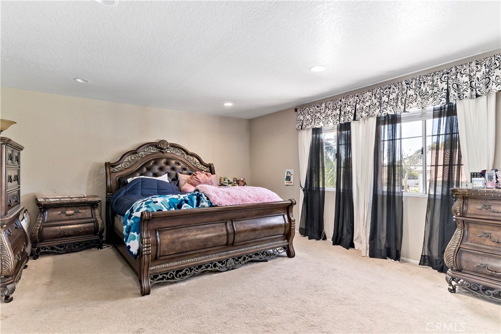 1491 Hunters Trail Glendora, CA 91740 - Photo 17 of 54 a bedroom with a bed next to a large window