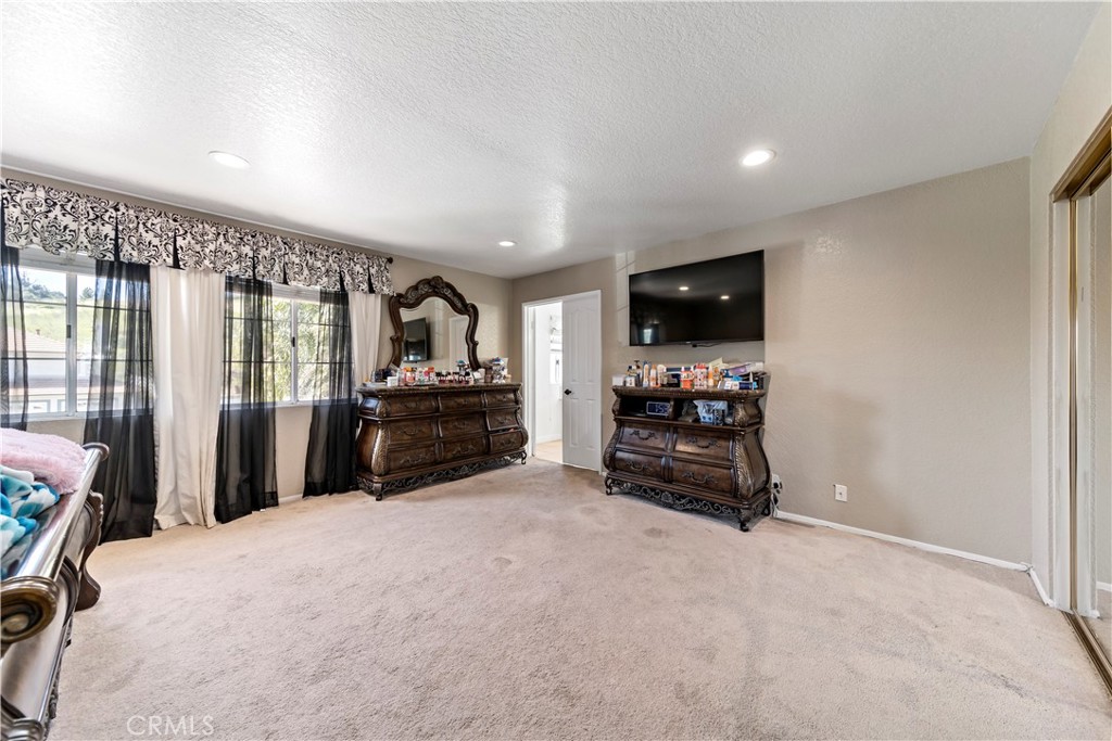 1491 Hunters Trail Glendora, CA 91740 - Photo 18 of 54 a room with furniture and a flat screen tv