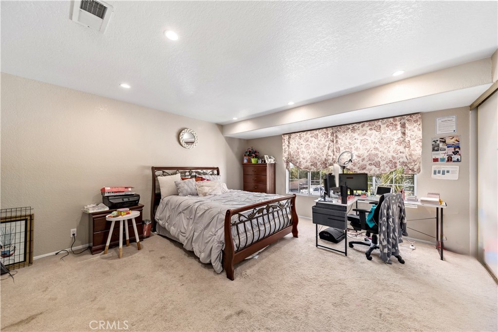 1491 Hunters Trail Glendora, CA 91740 - Photo 23 of 54 a bedroom with a bed a table and chairs