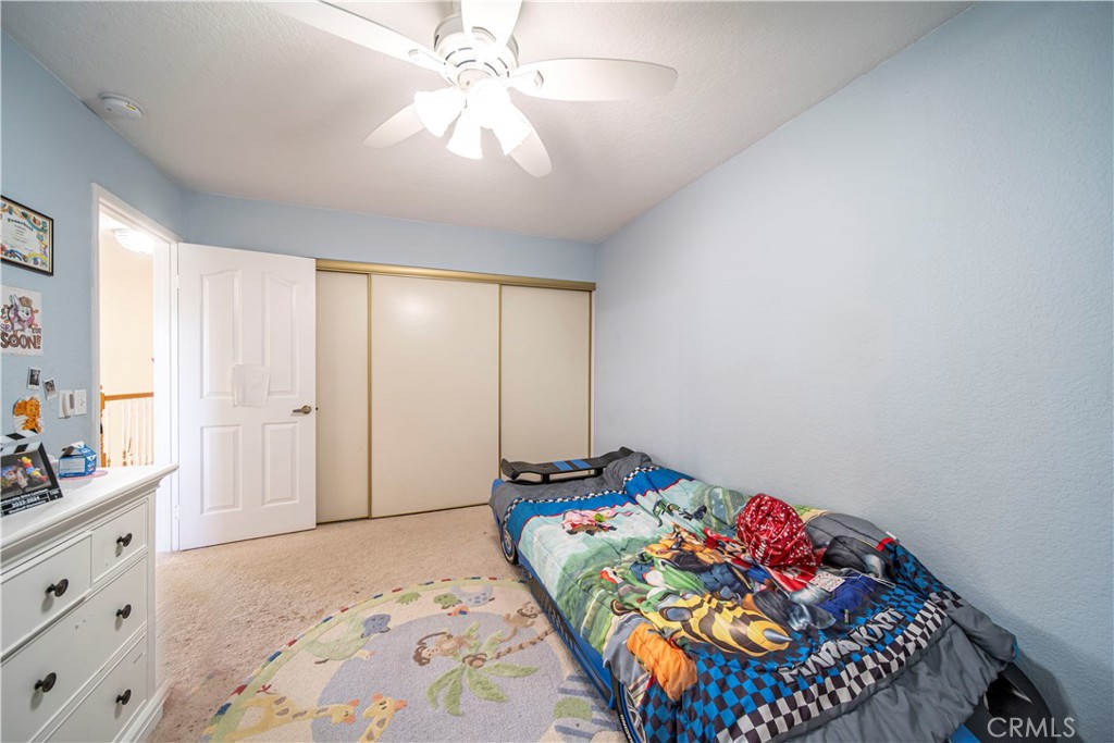 1491 Hunters Trail Glendora, CA 91740 - Photo 26 of 54 a bedroom with bed and a chandelier