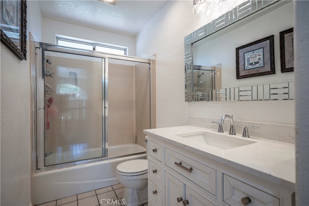 1491 Hunters Trail Glendora, CA 91740 - Photo 32 of 54 a bathroom with a sink a toilet and shower