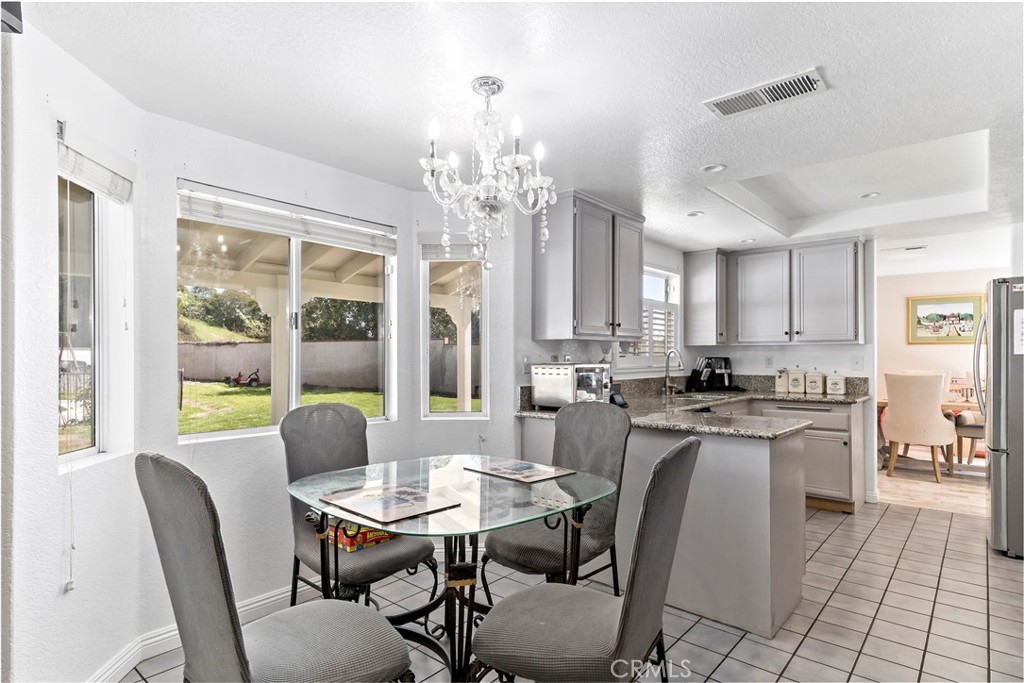 1491 Hunters Trail Glendora, CA 91740 - Photo 10 of 54 a view of a dining room with furniture window and outside view