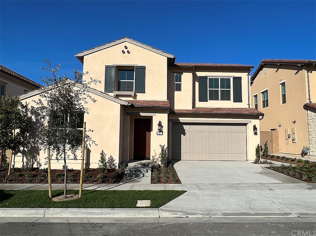 103 Parakeet Irvine, CA 92620 - Photo 1 of 1 a front view of a house with a yard