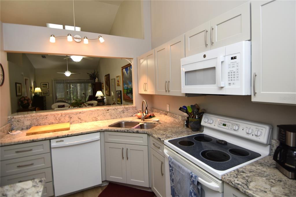 4941 Southwest 10th Lane Gainesville, FL 32607 - Photo 12 of 36 a kitchen with a sink and cabinets
