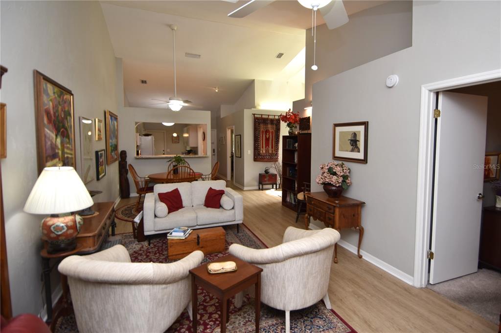 4941 Southwest 10th Lane Gainesville, FL 32607 - Photo 19 of 36 a living room with furniture and a wooden floor