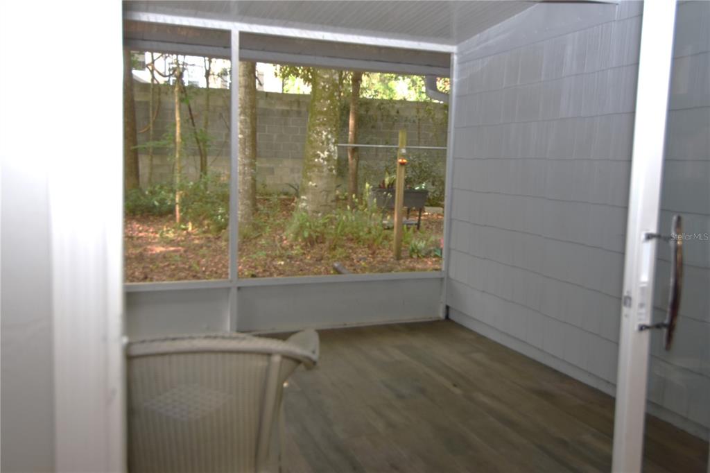 4941 Southwest 10th Lane Gainesville, FL 32607 - Photo 29 of 36 a view of a glass door and window