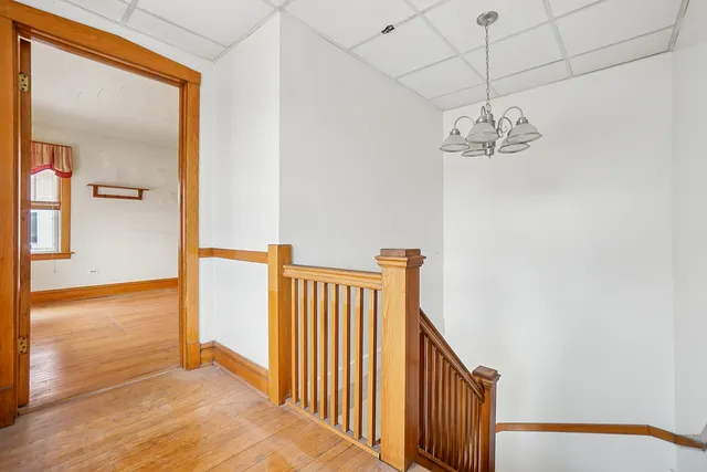 a view of a hallway with a chandelier