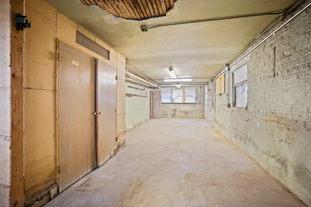 a view of a hallway with a cabinet