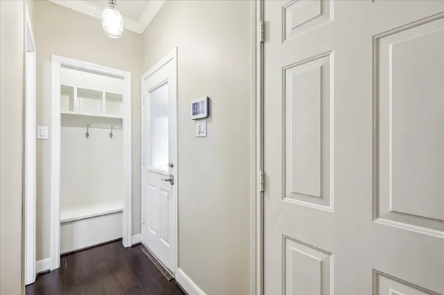 a dining room with furniture a rug and wooden floor