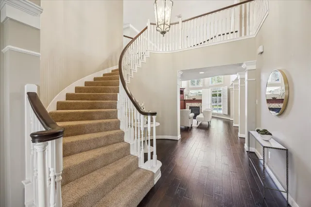 a room with stainless steel appliances kitchen island granite countertop a stove and a microwave