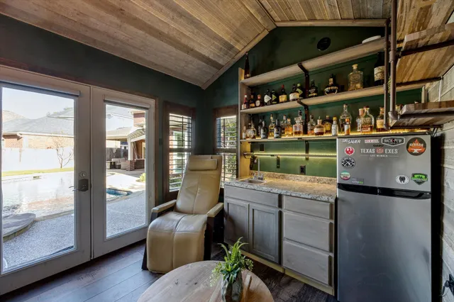 a kitchen with a stove and a refrigerator