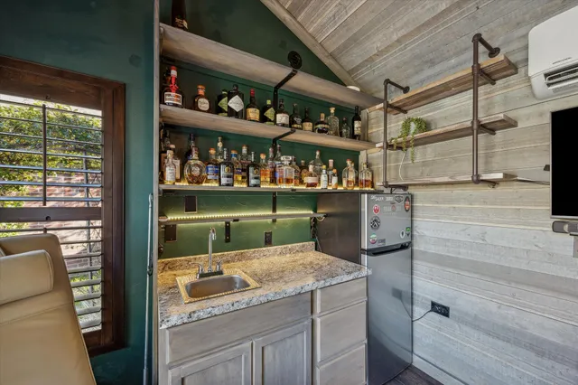 a view of workspace with wooden floor and windows
