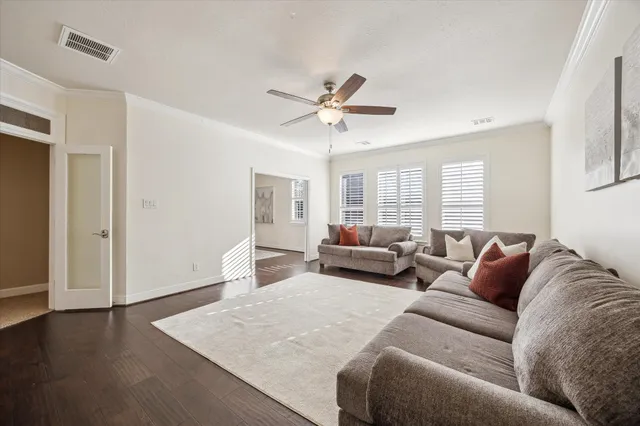 a room with pool table and windows