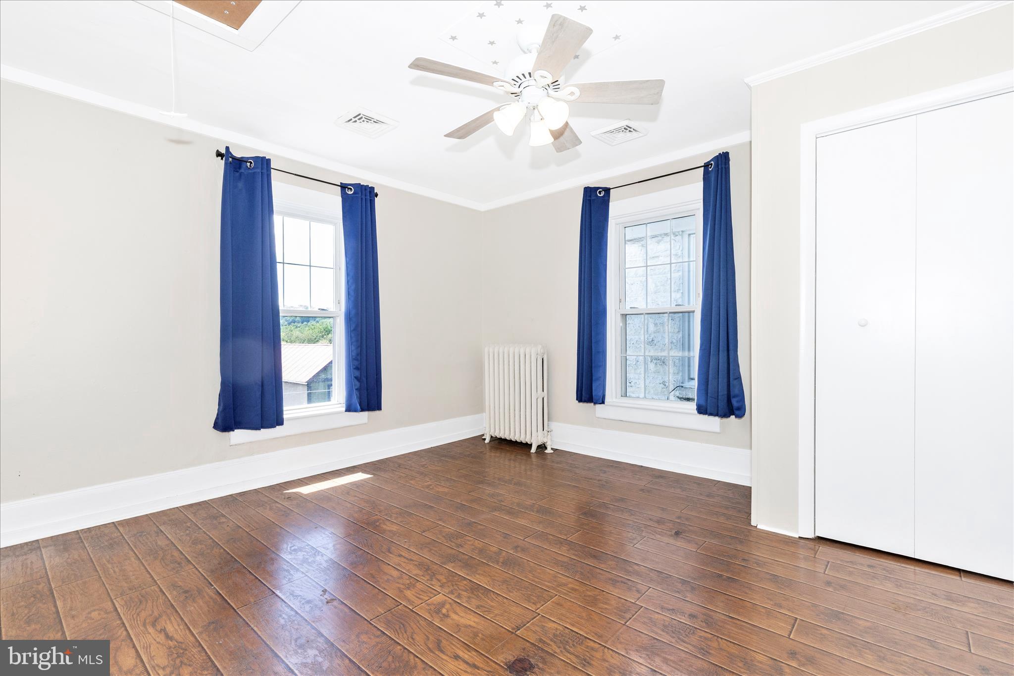 517 West Potomac Street Brunswick, MD 21716 - Photo 20 of 36 a view of an empty room with window and wooden floor
