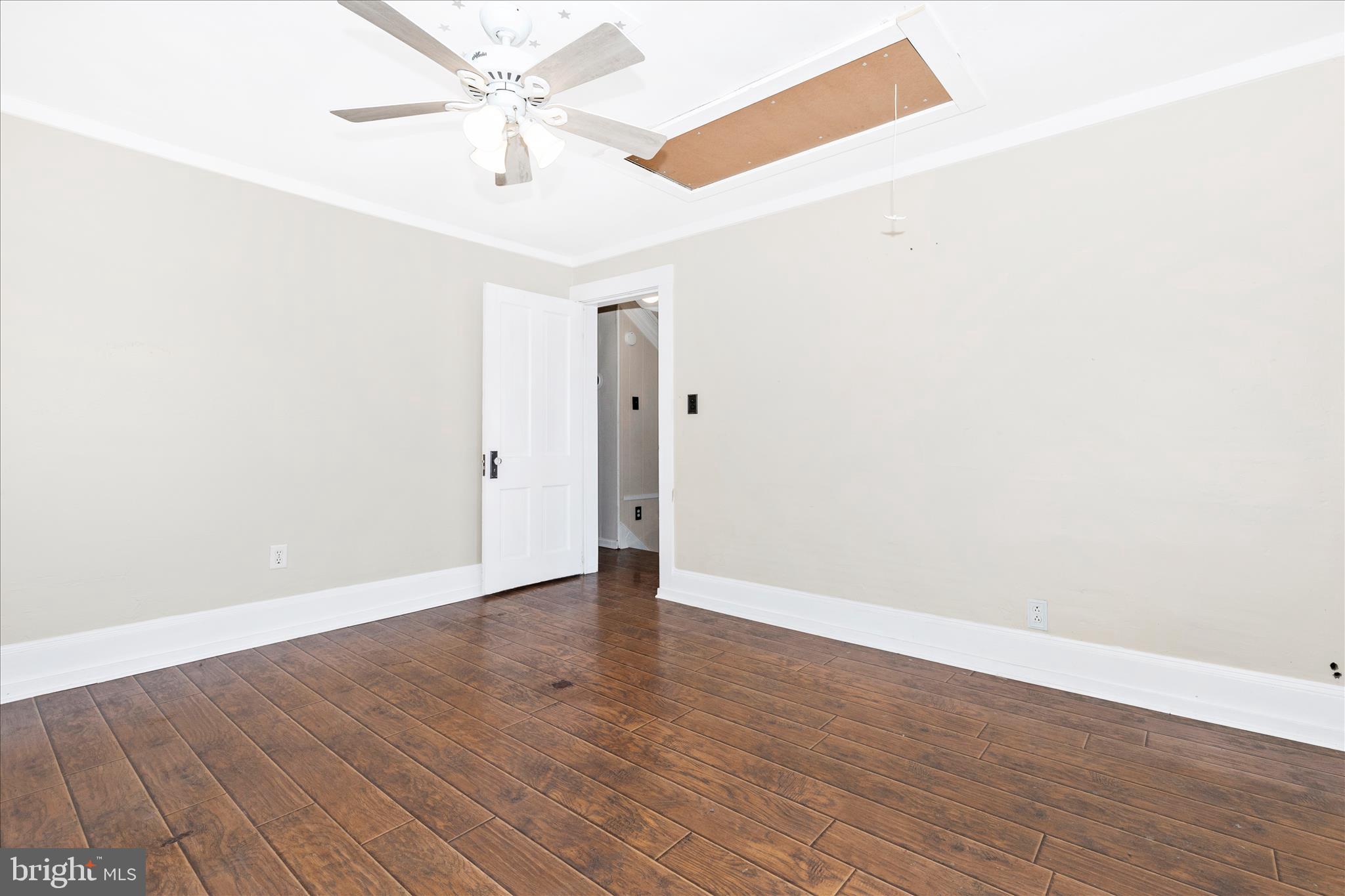 517 West Potomac Street Brunswick, MD 21716 - Photo 22 of 36 an empty room with wooden floor and ceiling fan