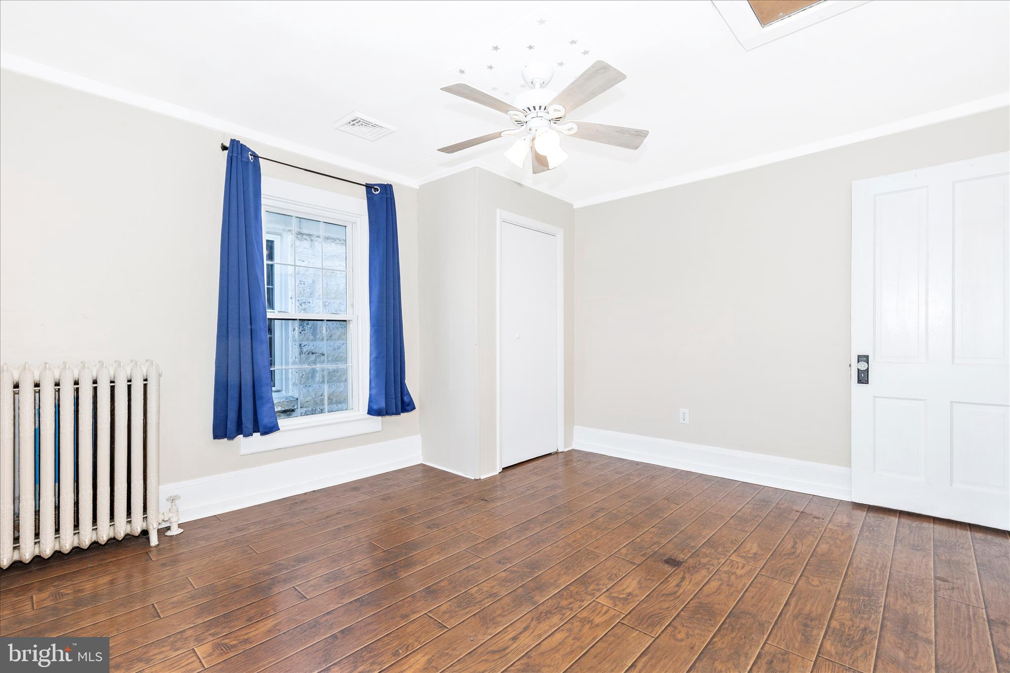 517 West Potomac Street Brunswick, MD 21716 - Photo 23 of 36 wooden floor in an empty room with a window