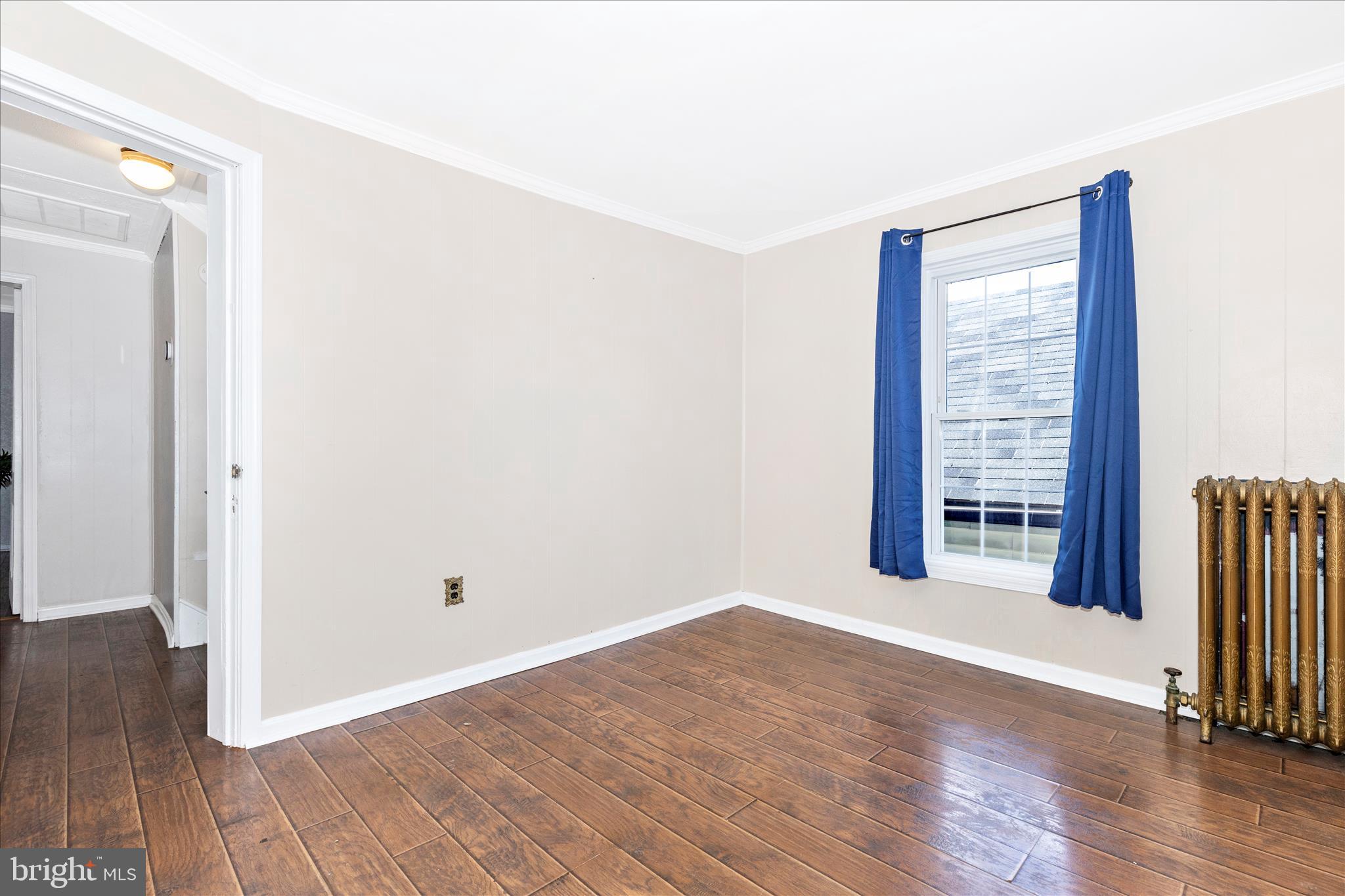 517 West Potomac Street Brunswick, MD 21716 - Photo 25 of 36 an empty room with wooden floor and windows