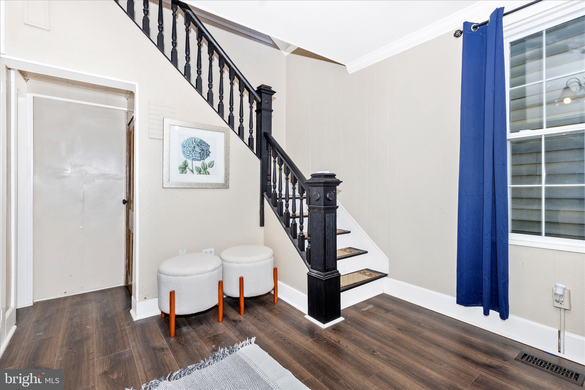 517 West Potomac Street Brunswick, MD 21716 - Photo 3 of 36 a view of a hallway with wooden floor and staircase