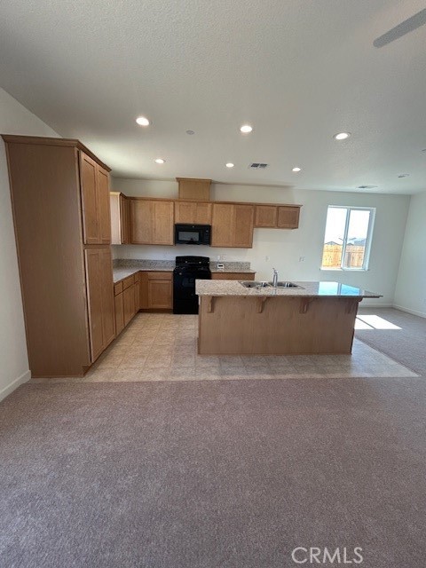 4705 Irma Drive Merced, CA 95348 - Photo 2 of 8 a living room with stainless steel appliances kitchen island a cabinets and a couch